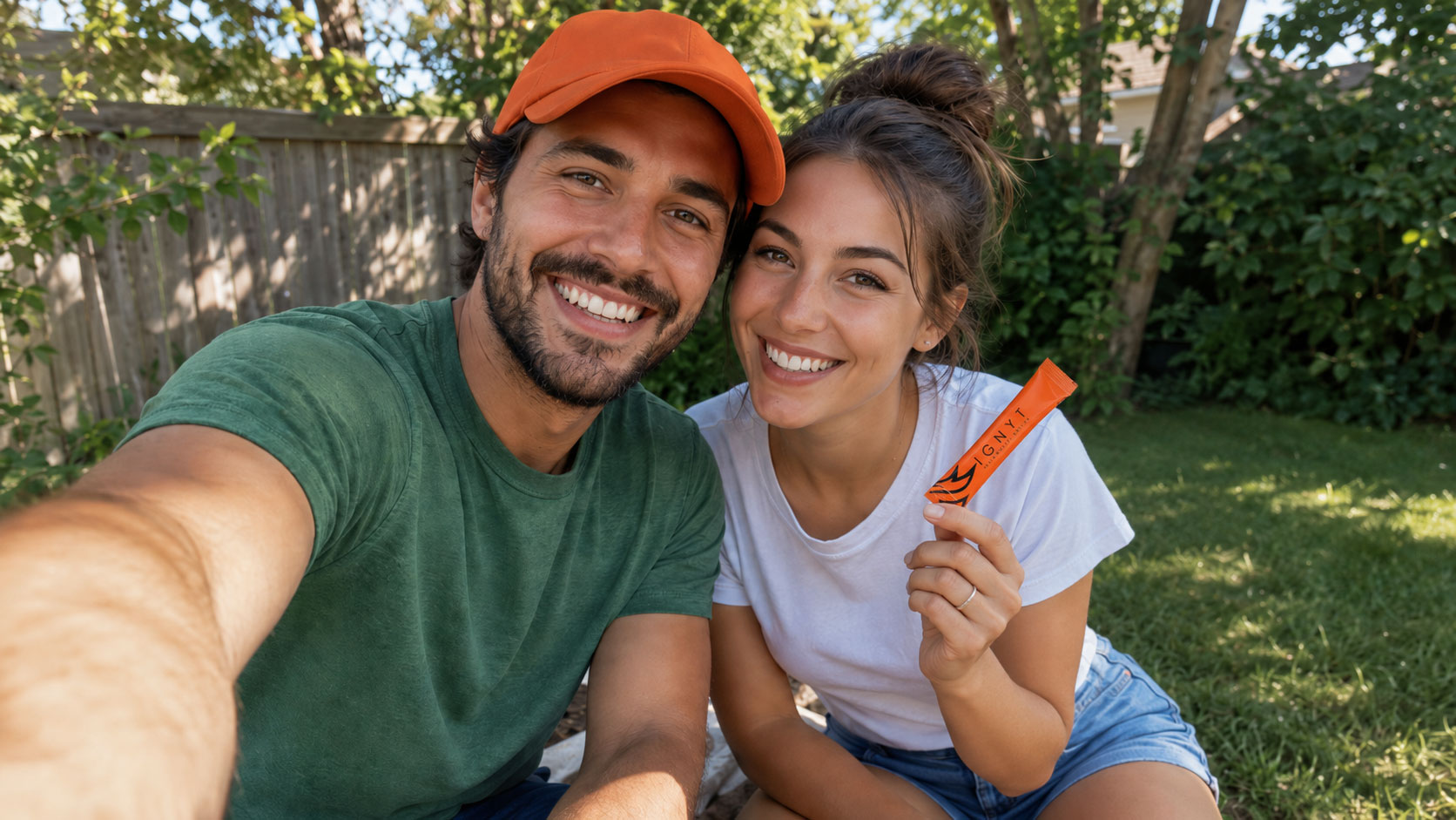 Couple smiling in their backyard holding an IGNYT stick
